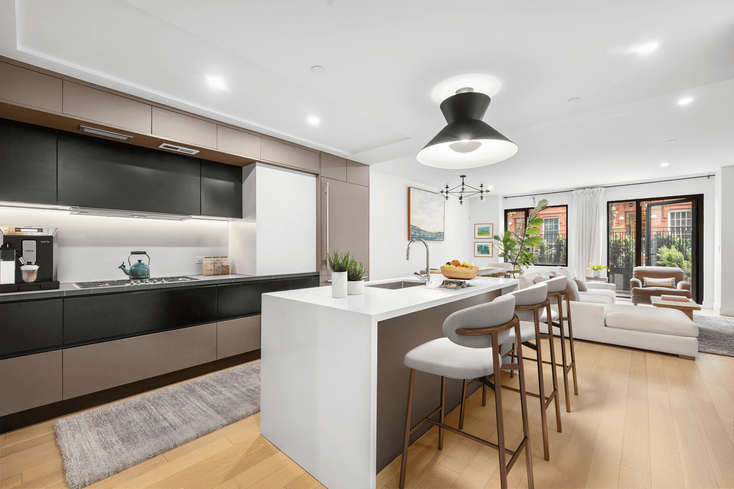 Welcome to Unit 1 at 318 East 81st Street a refined, garden level duplex that seamlessly blends the elegance of Upper East Side living with the openness of modern design.