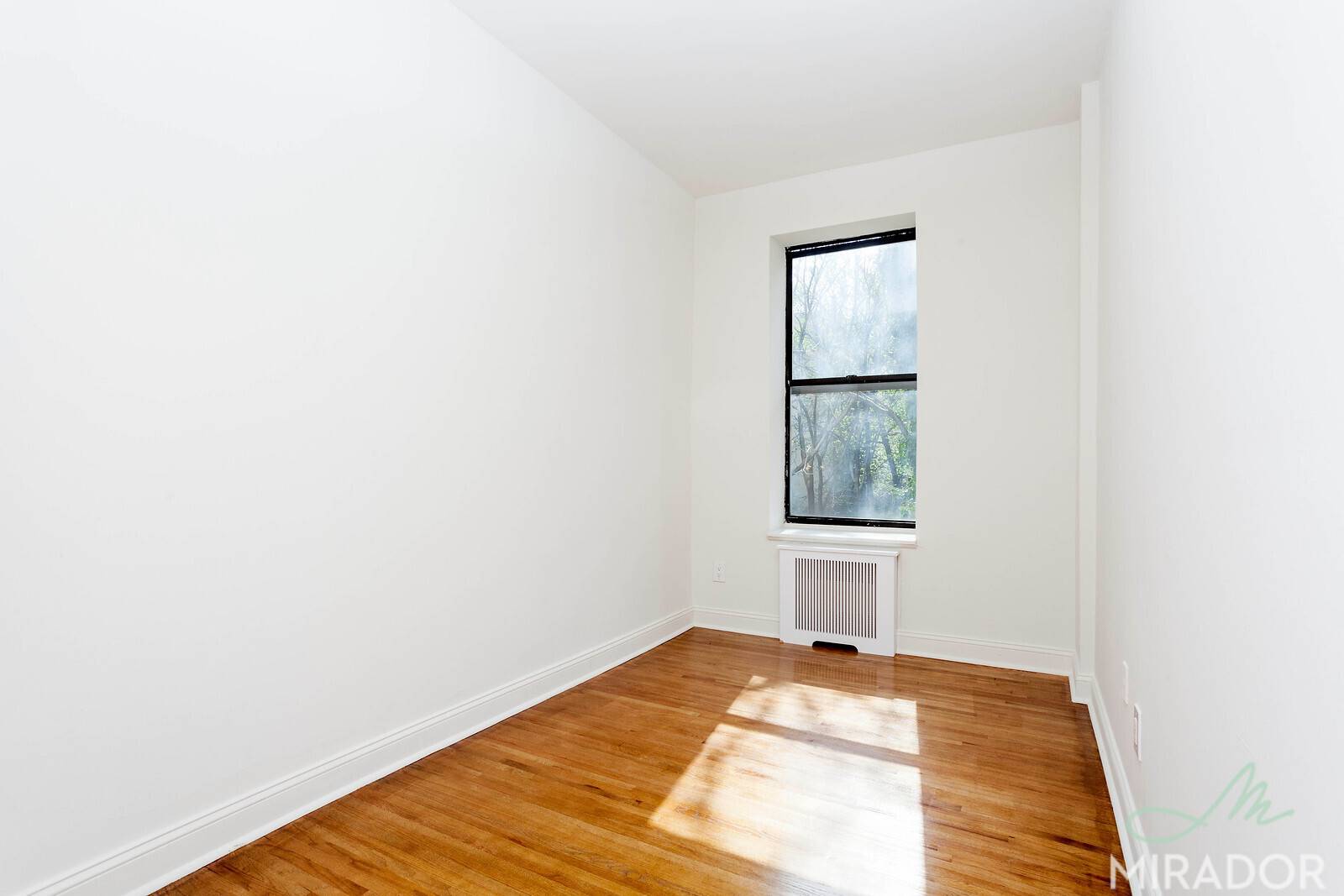 Large, sunny one bedroom apartment with high ceilings, lots of storage space, hardwood floors, dishwasher, and a queen sized bedroom.