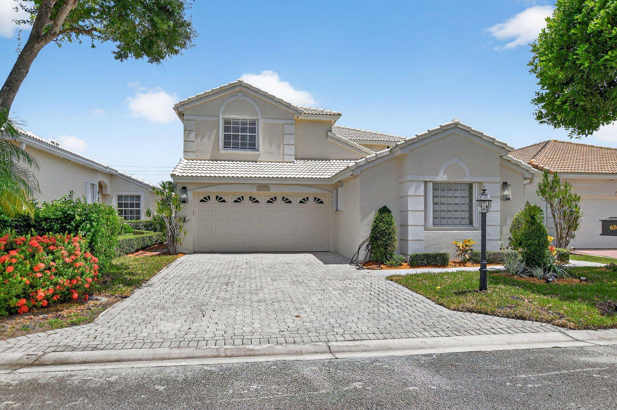 Spacious 4BR 3. 5BA single family home in a desirable gated Boca community with top rated schools.