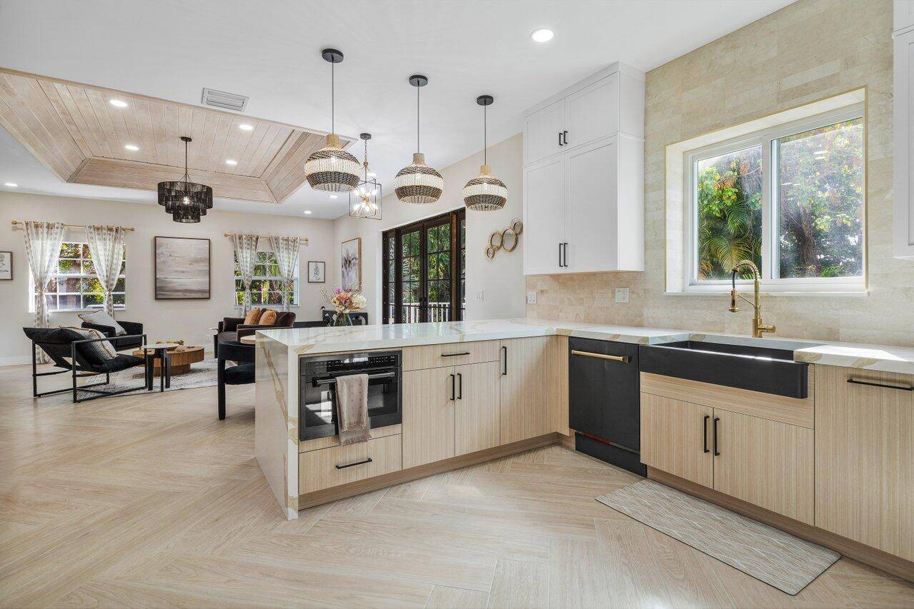 Step into sophisticated elegance with this fully furnished, turnkey rental, showcasing a bold, designer curated interior where modern luxury meets timeless glamor.