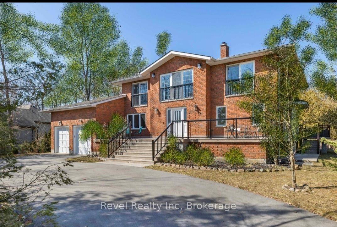 This spacious all brick home offers the perfect blend of comfort, functionality, and location ideal for multi generational living, family getaways, or full time lakeside living.