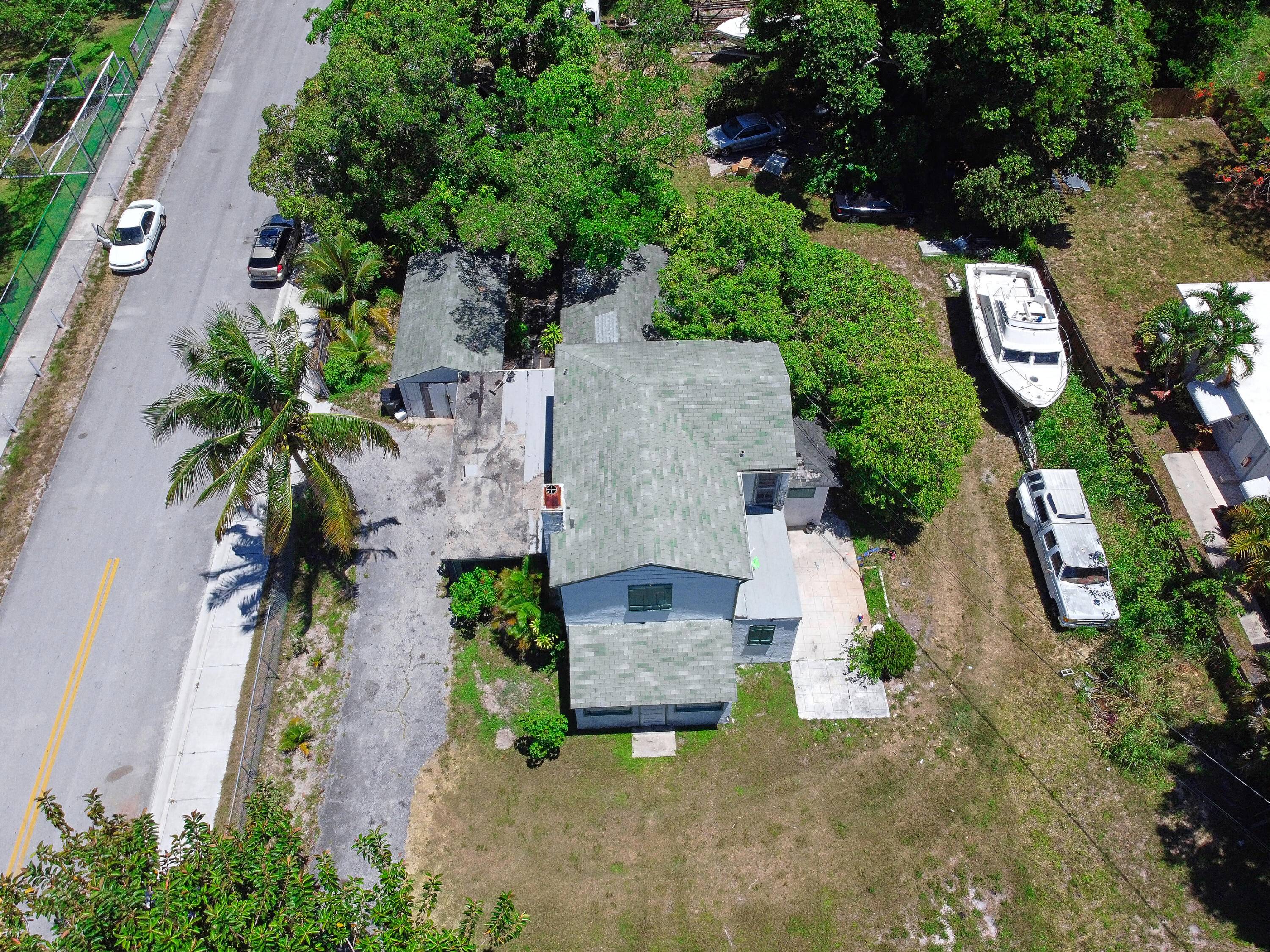 Seize the extraordinary opportunity to own and develop a sprawling half acre corner lot nestled in the heart of downtown Delray, a mere stone's throw from the serene waterfront.