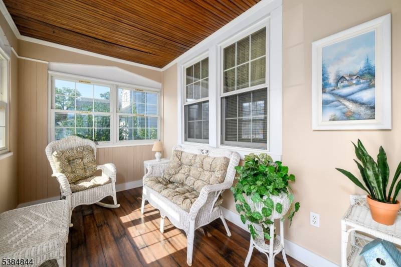 Well maintained two to three bedroom Colonial featuring enclosed front porch with easy care vinyl flooring and decorative fireplace, entry to foyer with access to formal living room with decorative ...