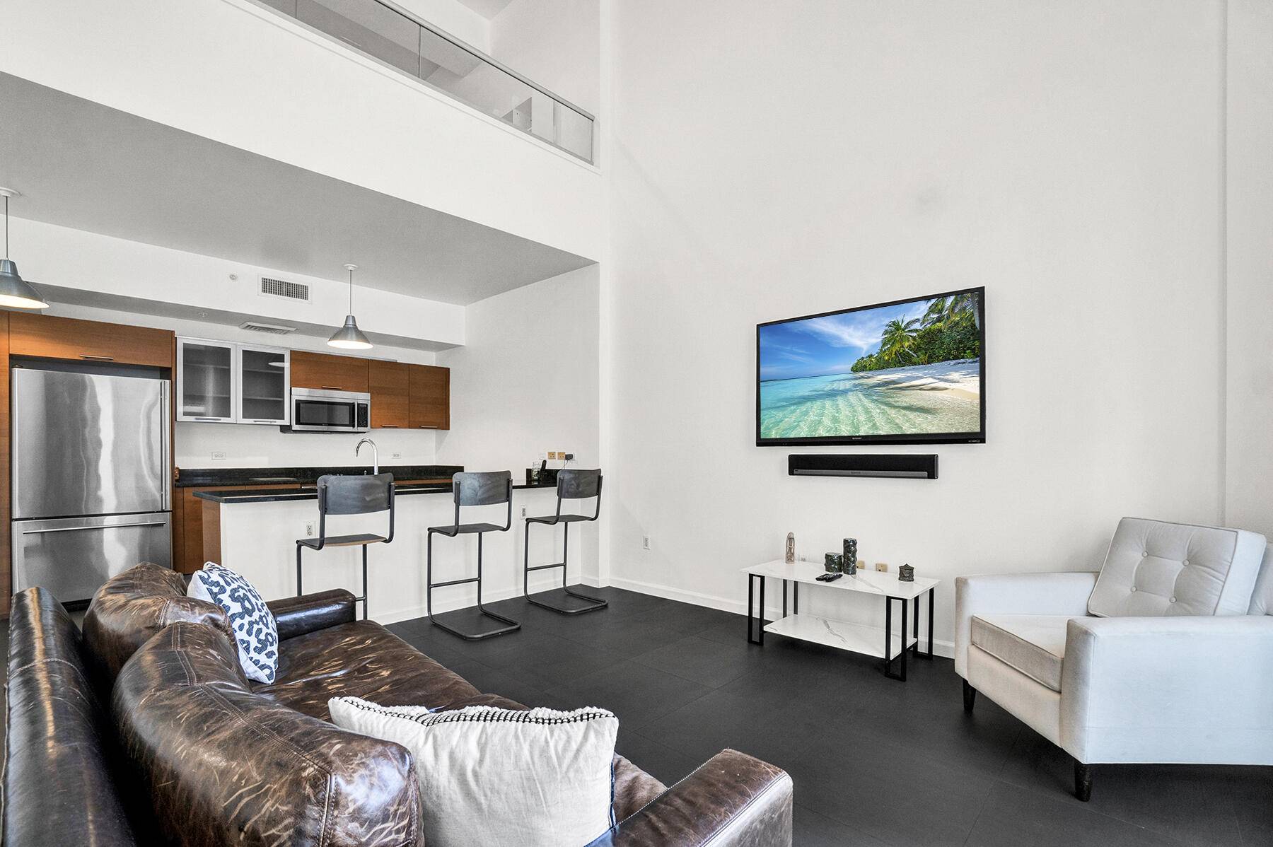 This NY Style LOFT with dramatic 20 foot ceilings at 2 Midtown is ideal for a Live Work lifestyle.