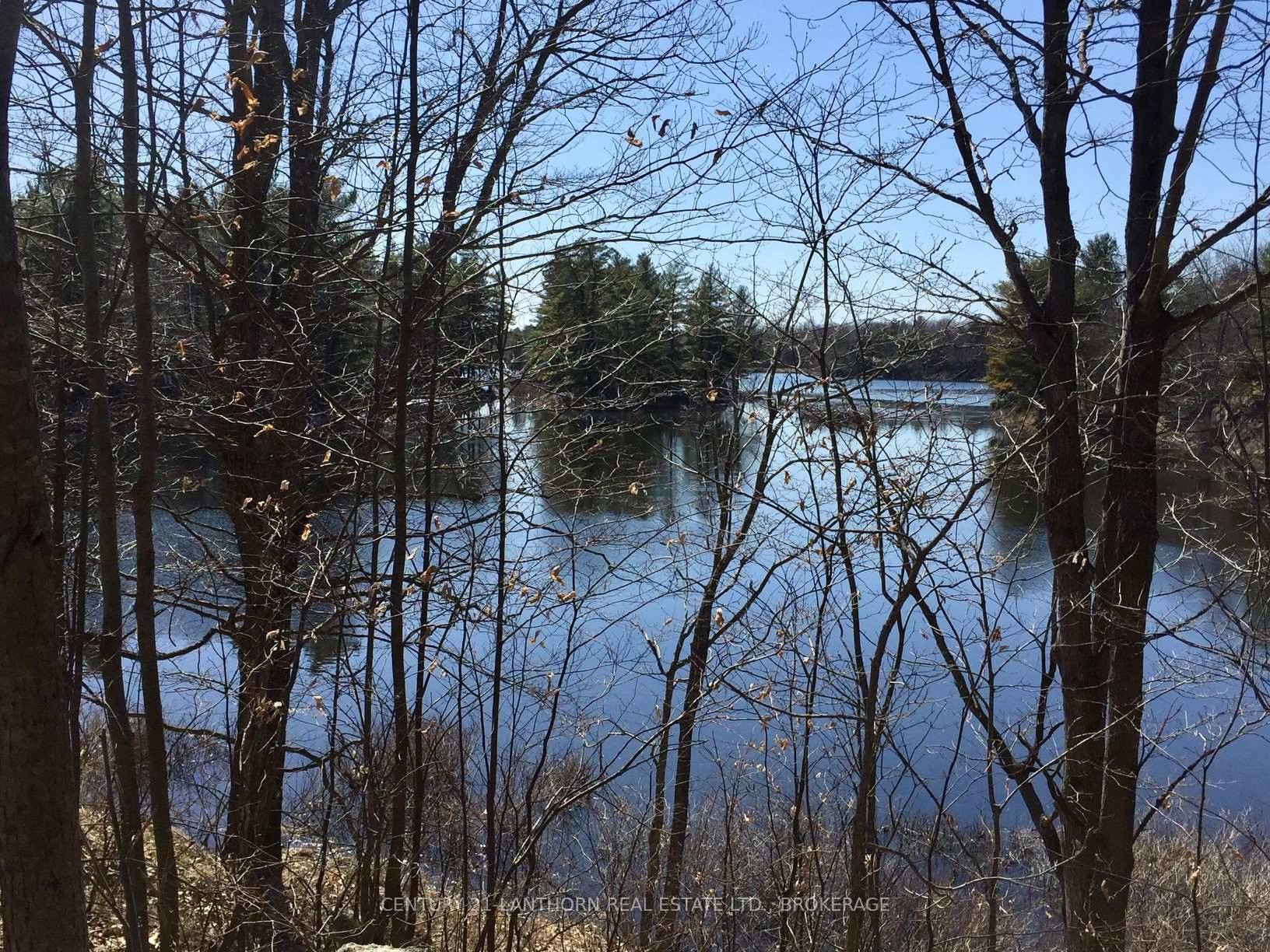 Escape to over 11 acres of secluded Canadian Shield wilderness on the shores of Little John Sister Lake, just 35 minutes from Hwy 38 and the 401.