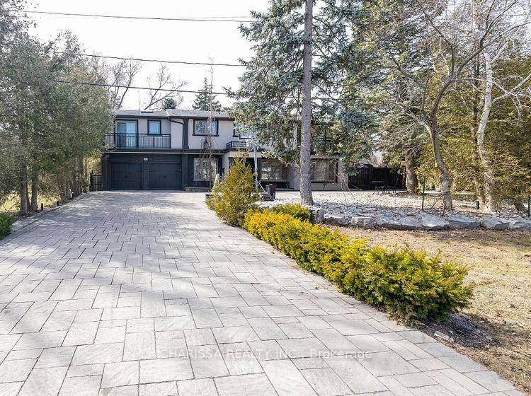 Situated on a prestigious street in sought after South Oakville, just steps from the lake, this architecturally designed custom home offers unparalleled luxury.