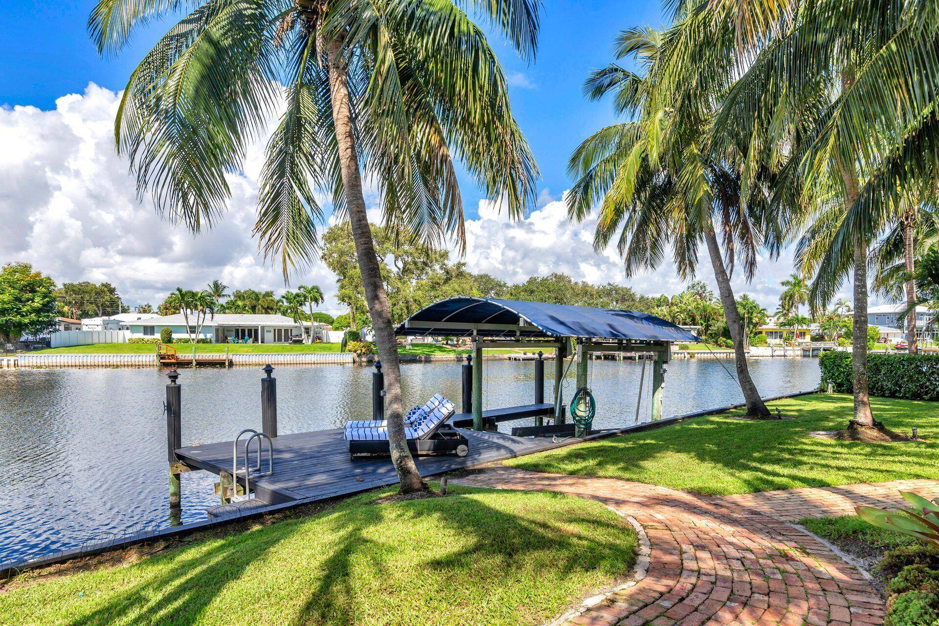 Spectacular waterfront home with a one of a kind resort style backyard !
