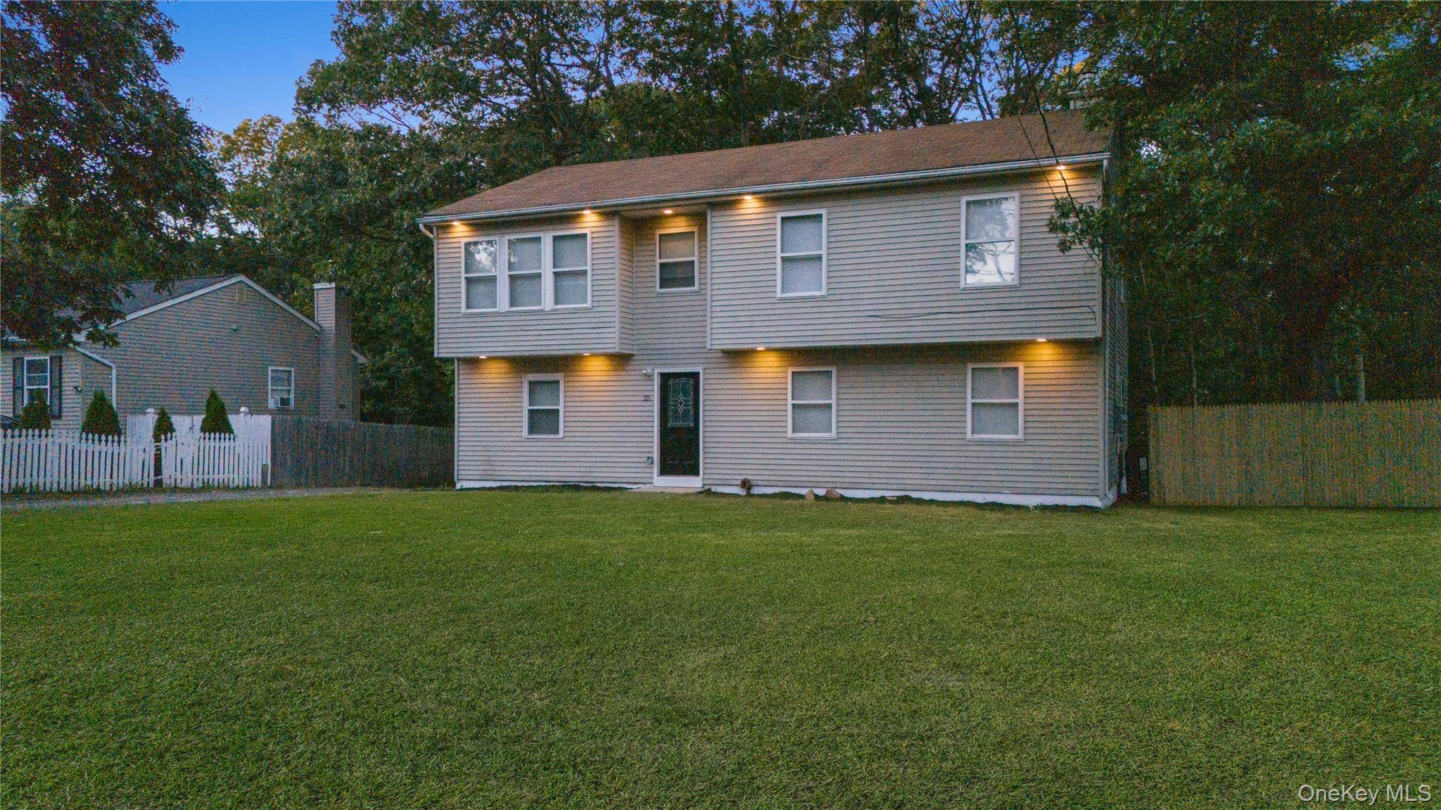 Welcome to 25 Nord Park Blvd in Middle Island, a fully renovated hi ranch offering an impressive 8 bedrooms, perfect for large families.