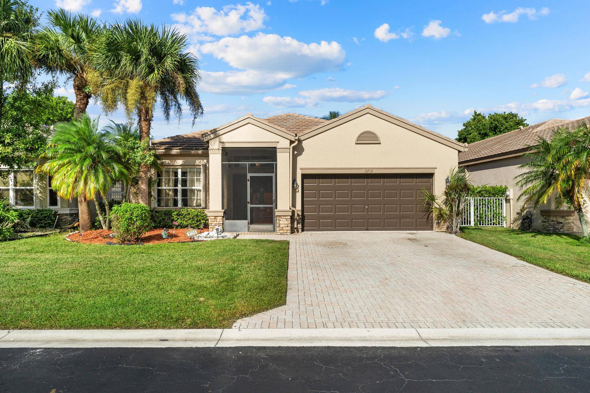Stunning 4BR 2BA waterfront home in a gated, family friendly community in Lake Worth.