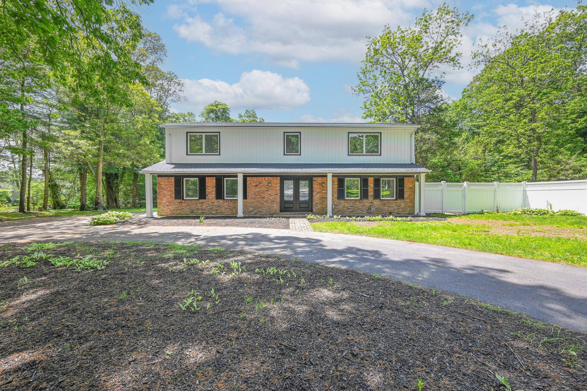 Step into timeless elegance with this fully renovated gem nestled on a full acre in the heart of Huntington !