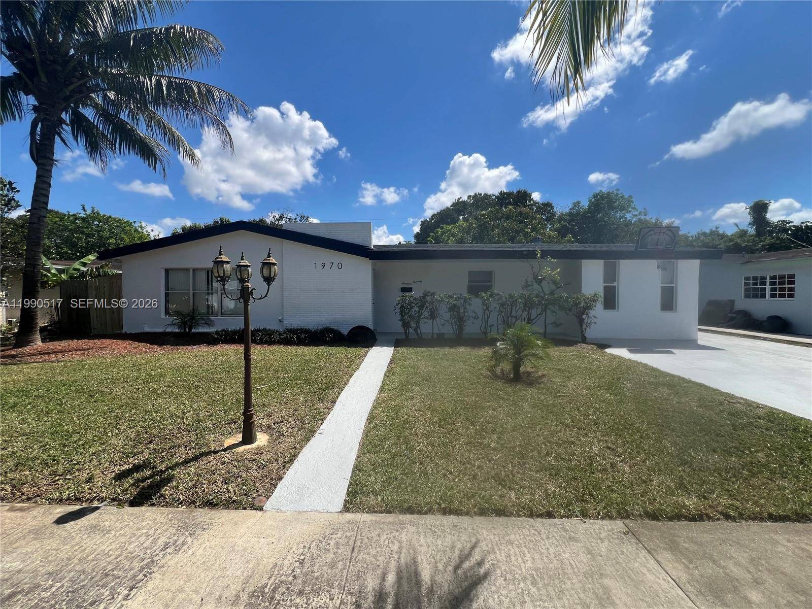 Welcome to this beautiful family residence of over 2, 000 square feet under air in the quiet neighborhood of Miami Gardens !