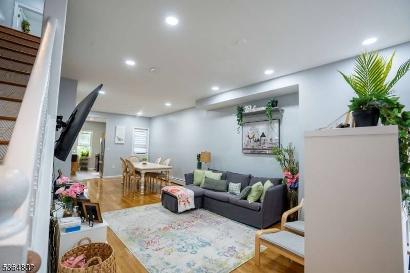 Situated in the vibrant heart of Newark City, this charming three story two family home offers a unique blend of comfort, space, and functionality.