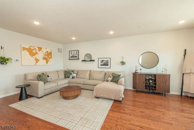 Welcome to this beautiful townhome that offers 2 bedrooms, 2 full baths, and 2 half baths across three spacious levels.