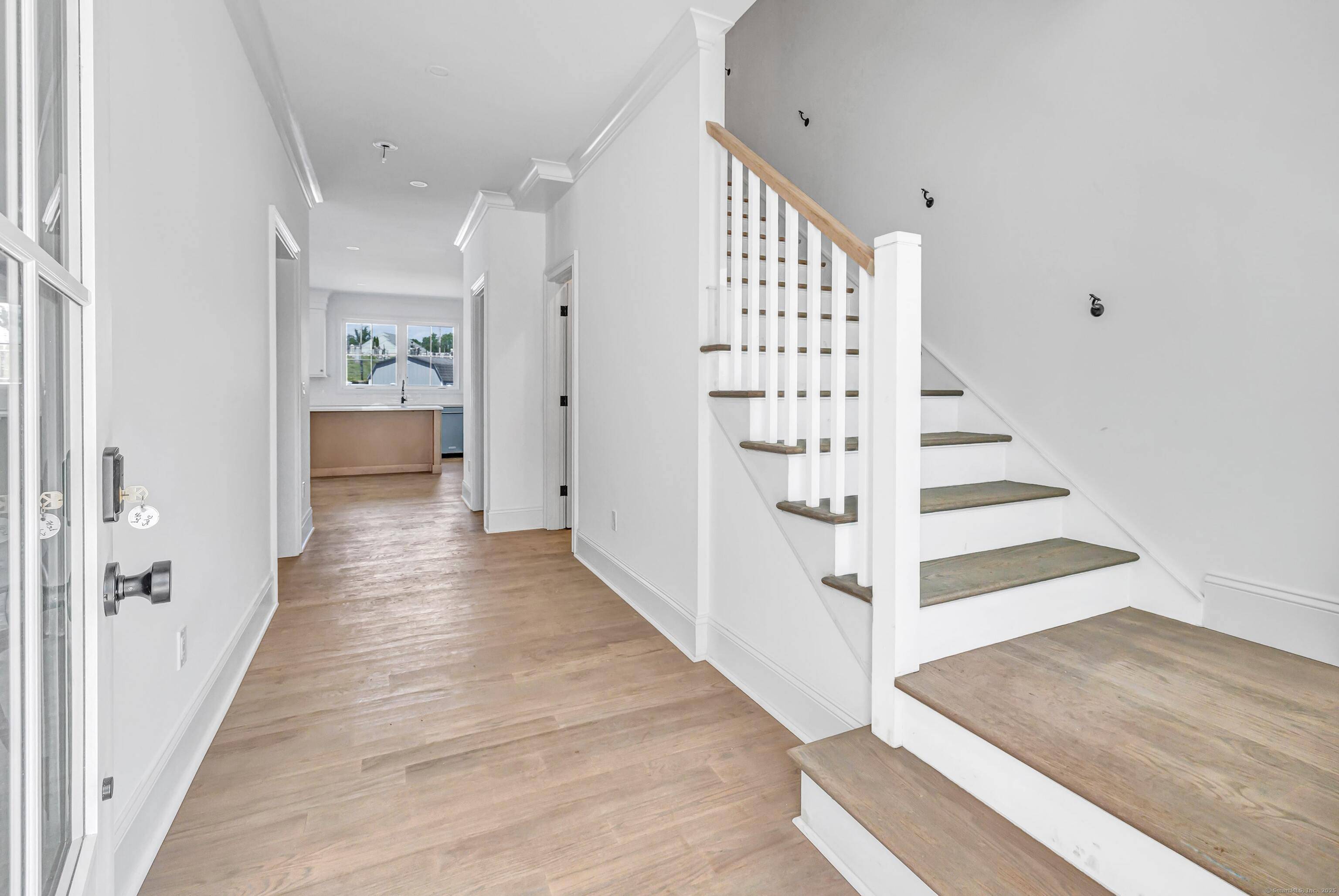 Welcome to this stunning, newly constructed duplex style residence where contemporary design and thoughtful details create a truly elevated living experience.