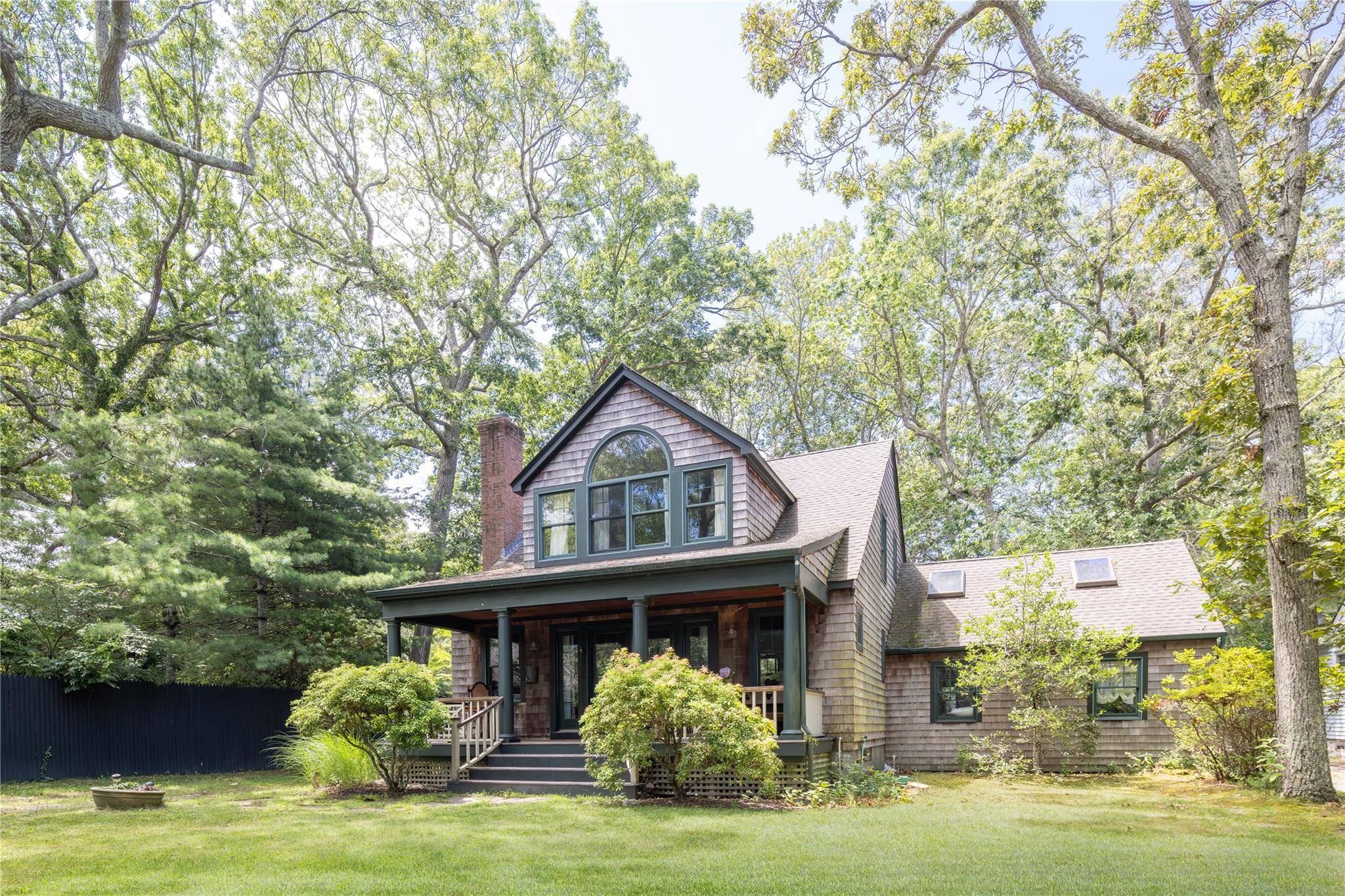 Located just 450 yards from a stunning sandy bay beach, this handsome Cape style home offers the perfect blend of coastal charm and year round comfort.