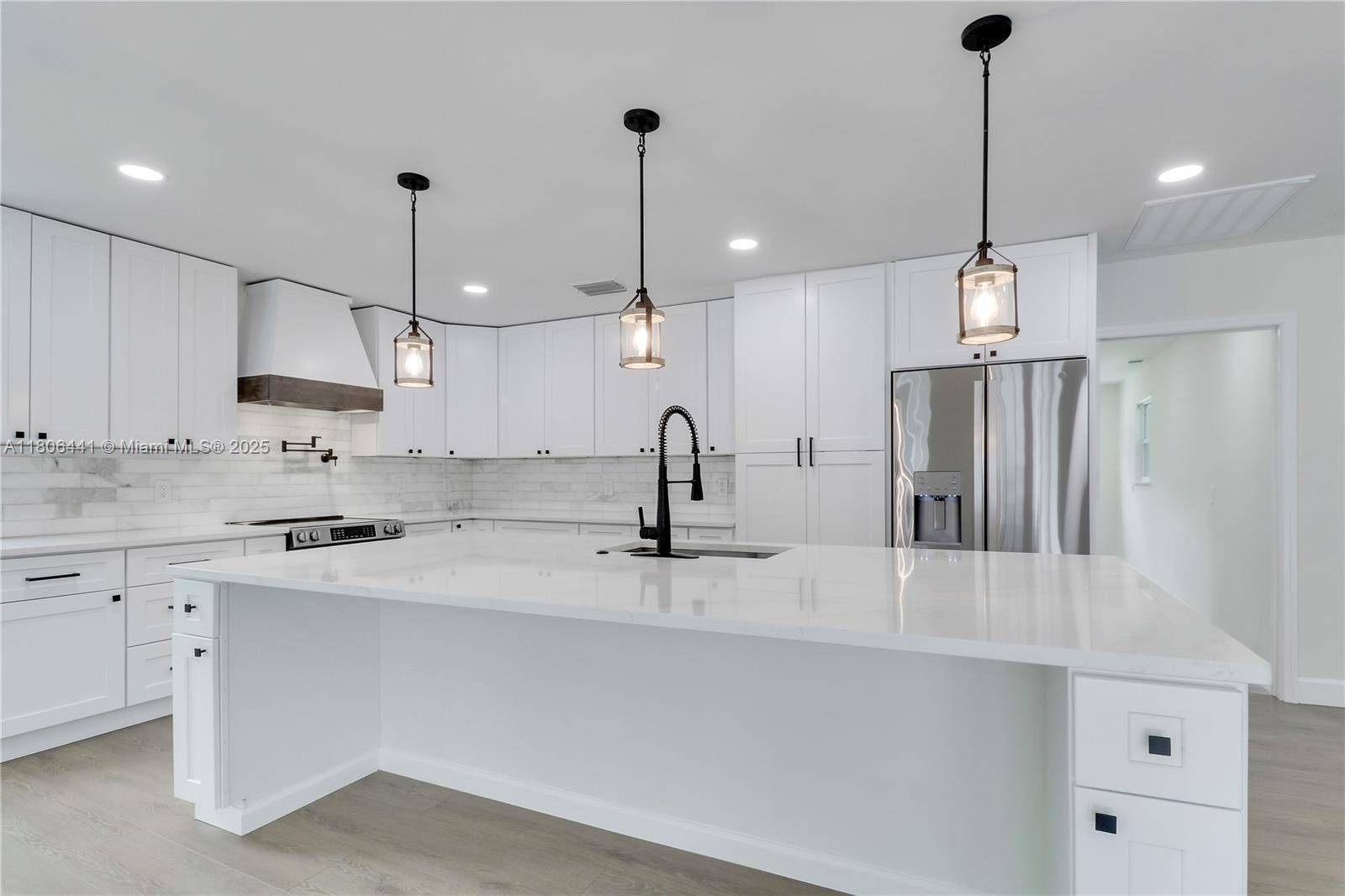 Completely Remodeled 4 Bedroom 2 Bathroom Pool Home with a Detached 500 Sq Ft 2 Car Garage on 1.