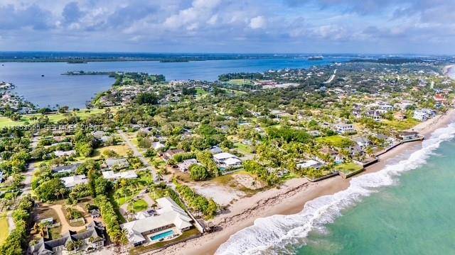 A rare opportunity to acquire 240 feet of direct Atlantic ocean frontage on an expansive 1.