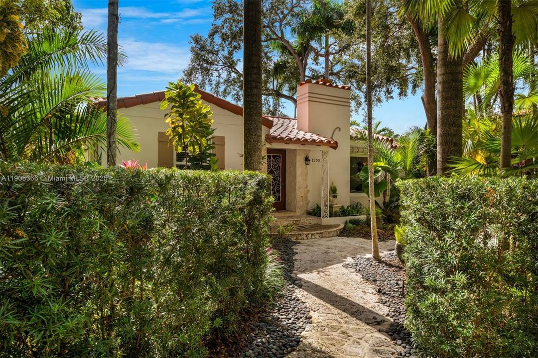 Step into understated elegance with this beautifully updated 1930s Coral Gables residence, where Mediterranean charm meets modern sophistication.