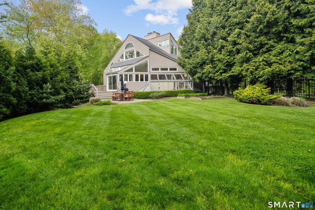 Discover this stunning five bedroom contemporary on a premier quiet New Canaan cul de sac just five minutes from town.