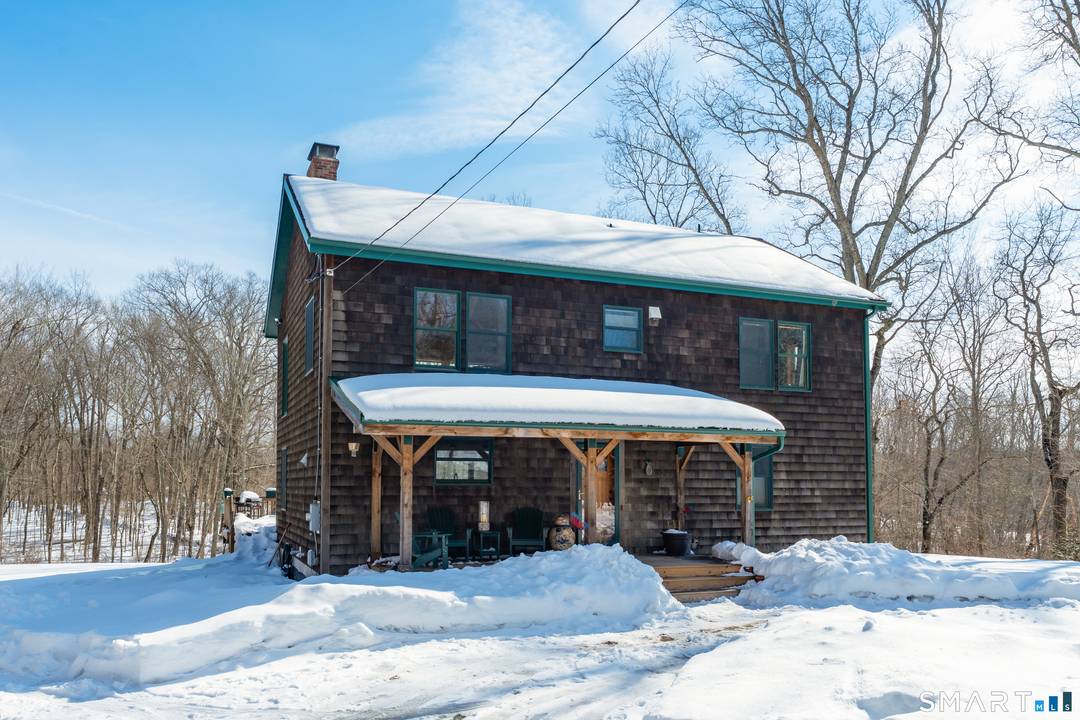 Beautifully landscaped, this custom built Post and Beam Contemporary sits on almost 2 acres and embodies the feeling of living in a vacation home.