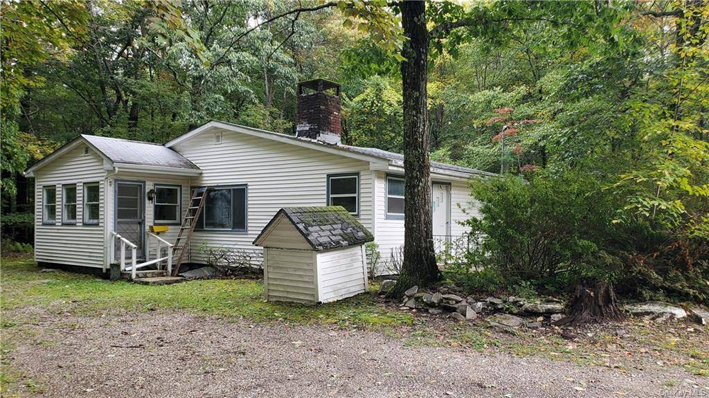 cute cozy 2 Bedroom Home, driveway in both sides for for 2 cars, surrounded with tree's and privacy, shed, Needs Rehab Price reflects