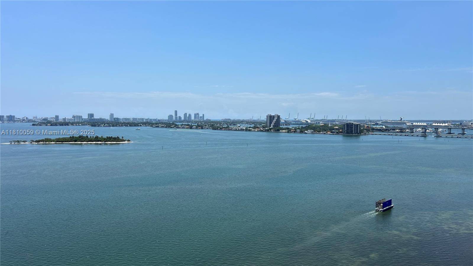Enjoy stunning unobstructed panoramic bay views from spacious two bedroom, two bathroom, corner residence with long wrap around balcony in Star Lofts on the Bay in Edgewater district.