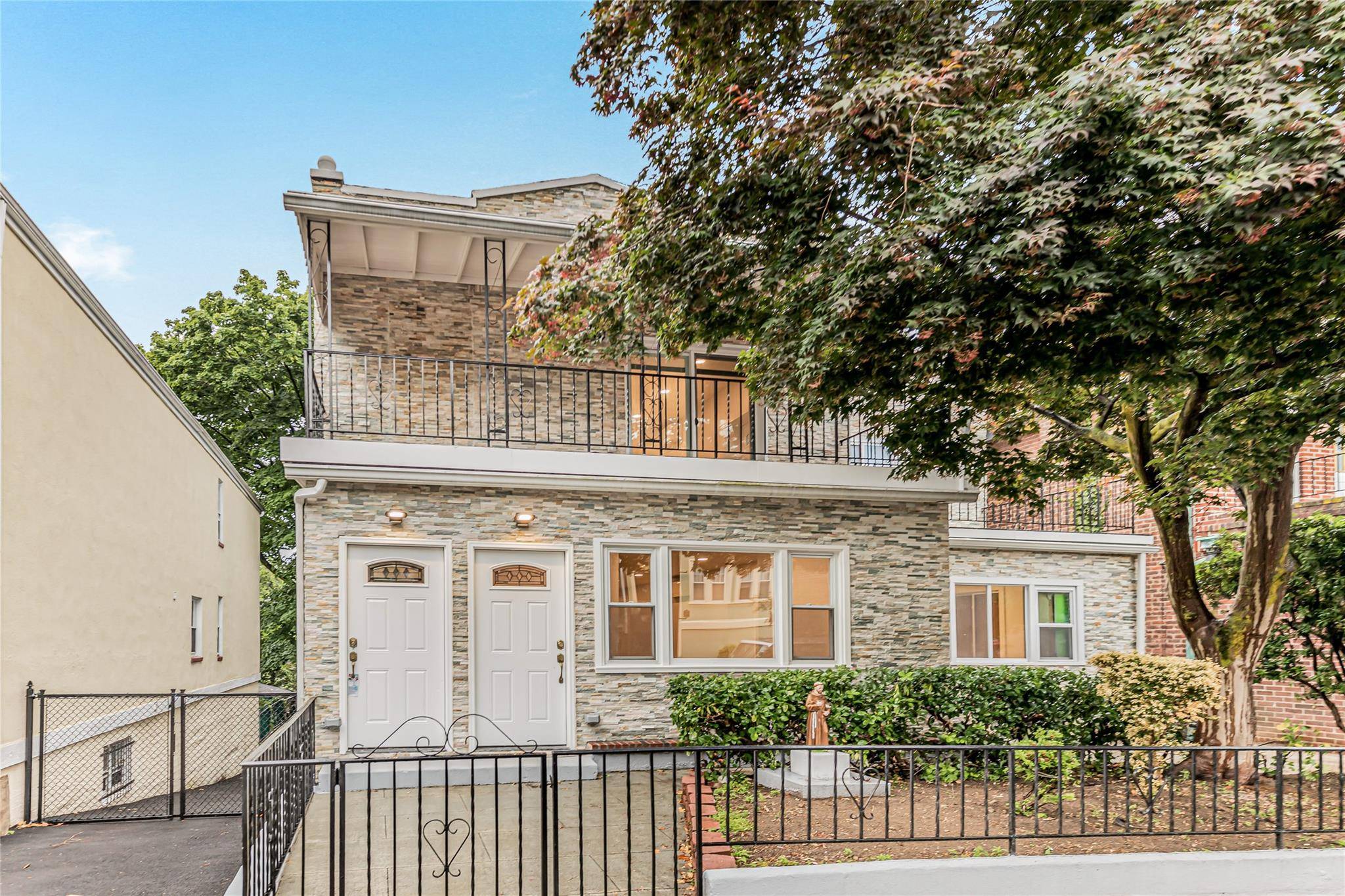 Enjoy modern suburban living in this fully renovated two family home located on a quiet, tree lined street in the heart of Riverdale.