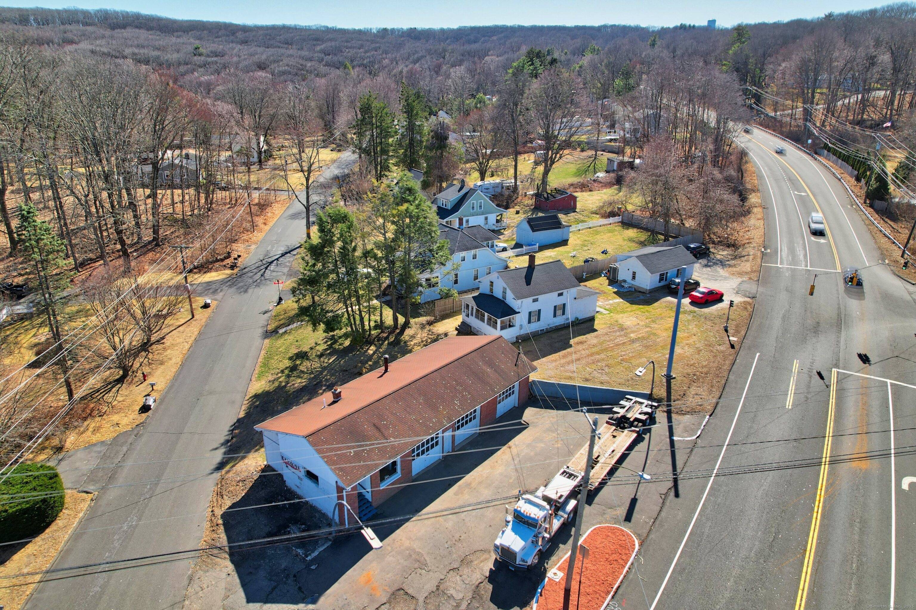 Prime Commercial Property with Service Garage Single Family Residence on Route 69 Discover a unique investment opportunity with this versatile commercial property, ideally located on high traffic Route 69.