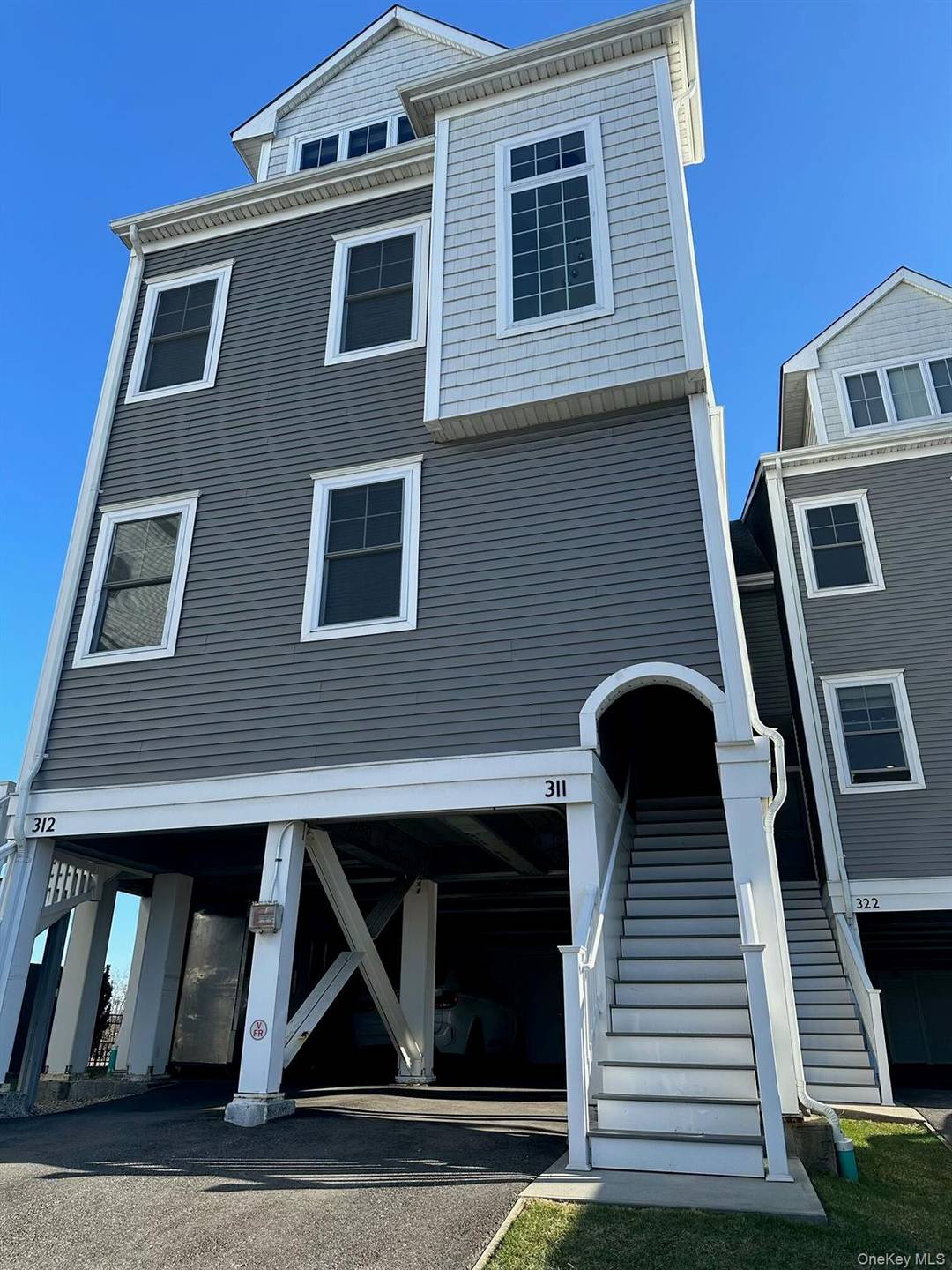 This beautifully designed two bedroom, two and a half bath townhouse offering serene water views and modern comfort.