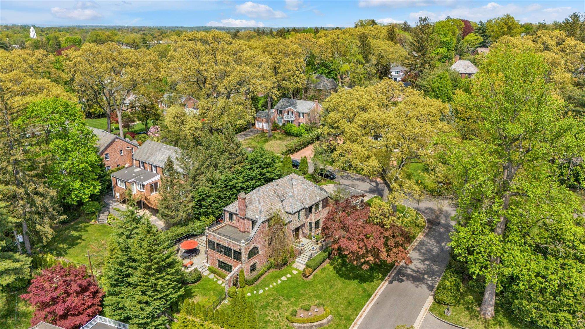 Exquisitely renovated English Tudor Estate Manhasset Presenting 183 Mill Spring Road, where old world charm meets modern luxury.