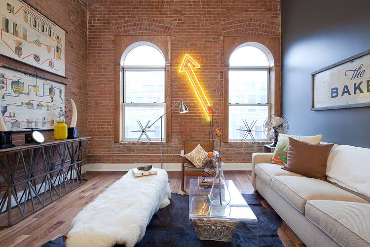This authentic Factory Loft Conversion features 17 foot soaring ceiling height, a full wall of exposed brick and so much more.