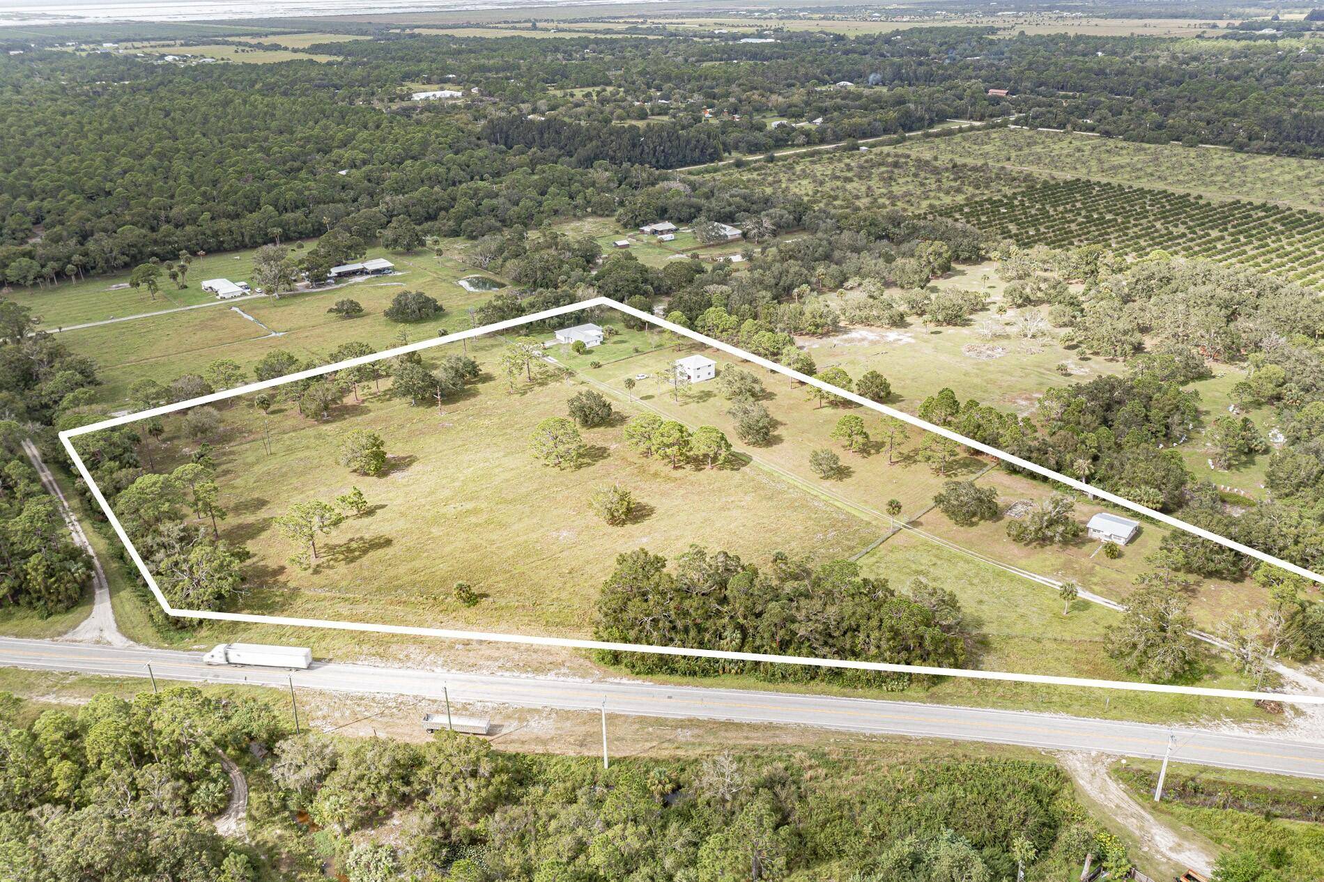 10. 98 acres with 3 2 CBS main home, 2388 sq ft, Separate garage building 2 car, 2 story CBS w full loft, and separate 2 1 CBS cottage that ...