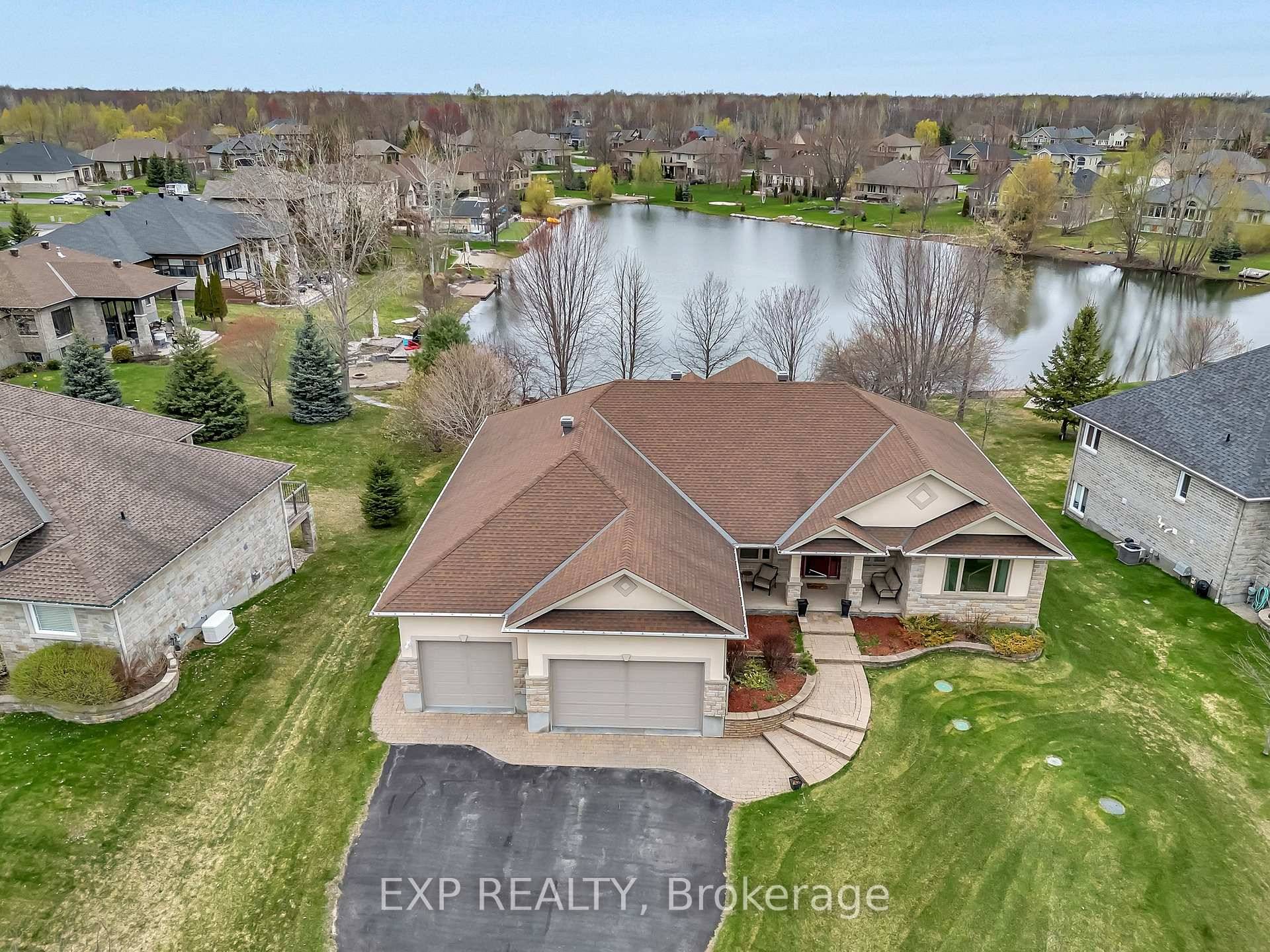 Welcome to 6703 Suncrest Drive an opportunity to own a luxurious waterfront bungalow in the heart of Greely.