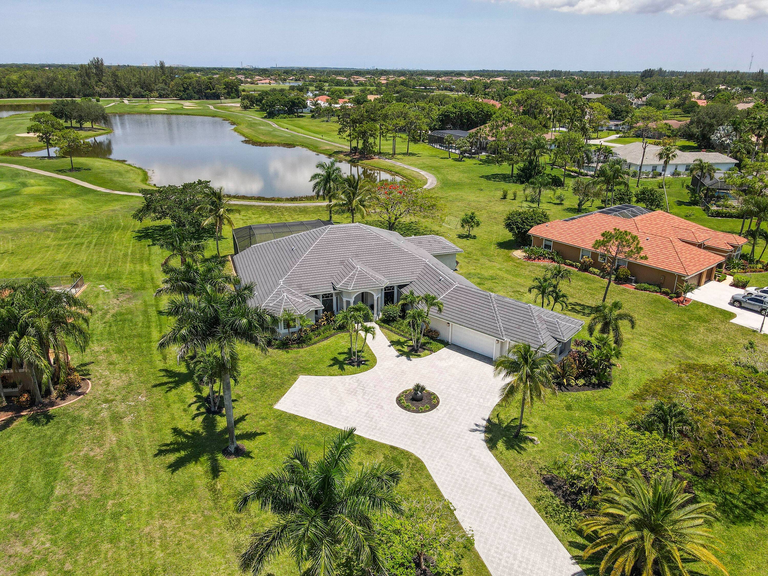 Enjoy the BEST WATER VIEW in Bay Hill Estates from this single story home set on a full 1 acre lot.
