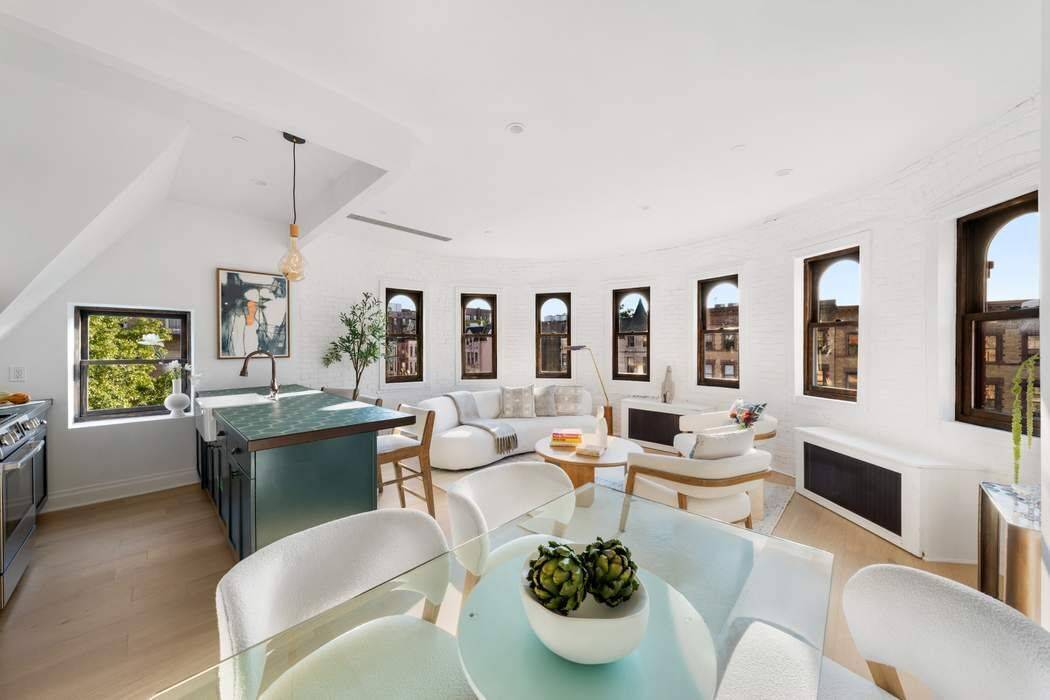 A rare architectural jewel perched above the treetops of Hamilton Heights, this luminous penthouse captivates with extraordinary light, sweeping rooftop views, and an unmistakable sense of character.