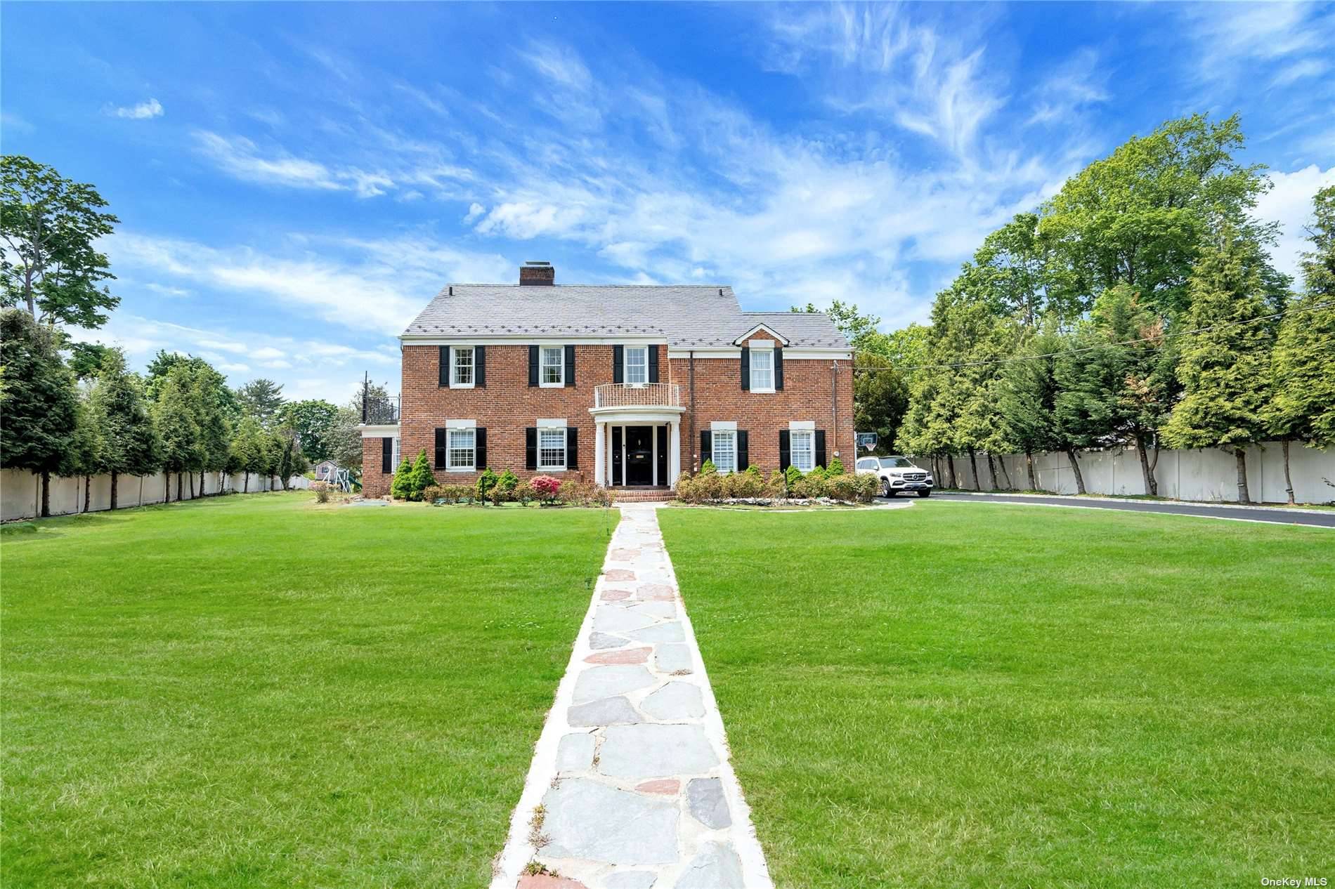 GLEN COVE. Beautiful Brick Colonial, behind gates, on over an acre in Glen Cove.