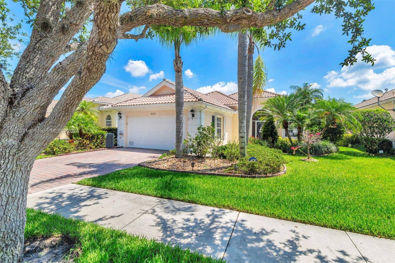 Welcome to this stunning turn key if desired home nestled along one of the most picturesque, oak tree lined streets in Hobe Sound.