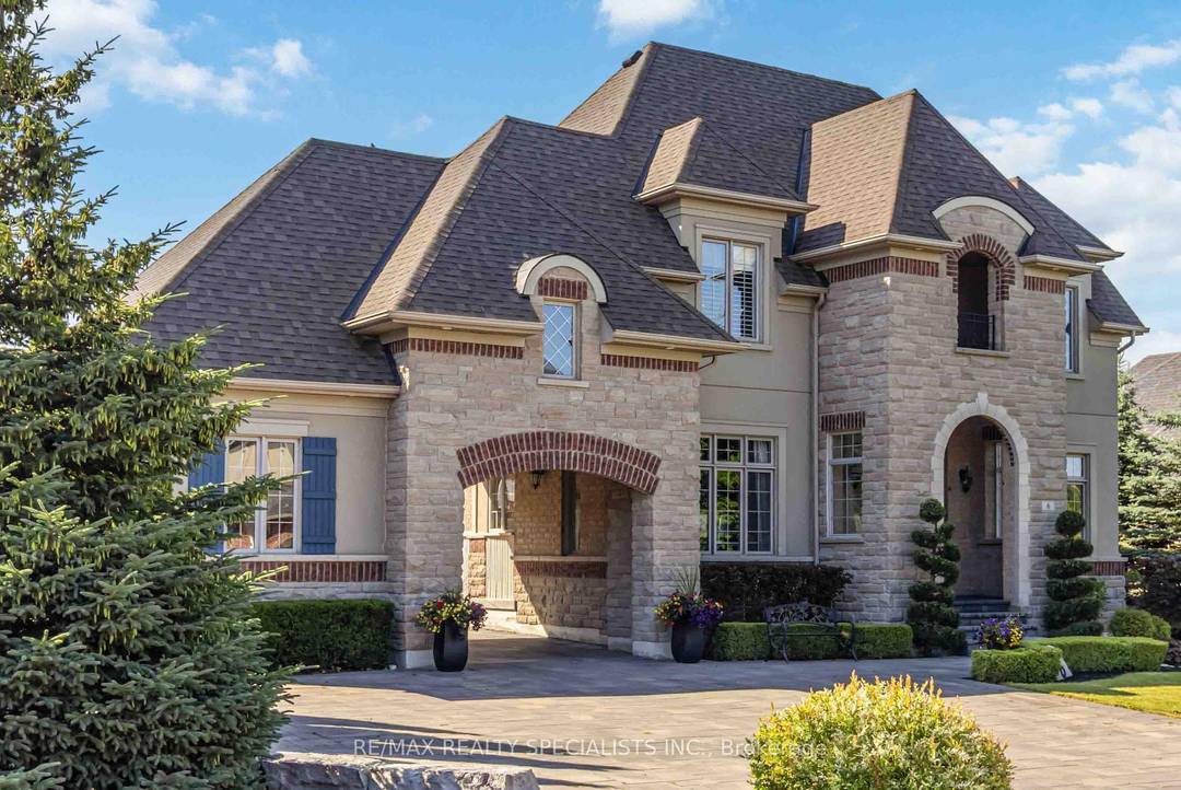Imagine pulling through your own private estate, where a courtyard welcomes you to a majestic three car garage framed by lush landscaping.