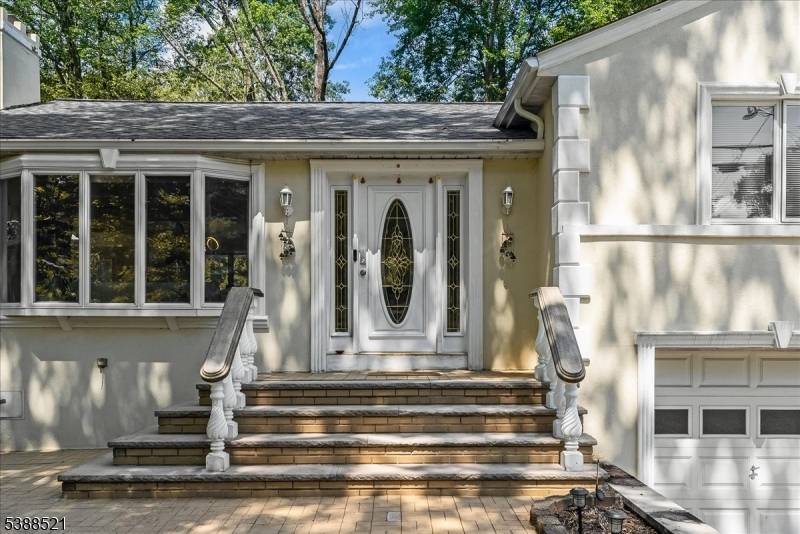 Nestled on a picturesque half acre in coveted North Caldwell, this updated 4 bedroom, 3 bath split level home offers both style and versatility.