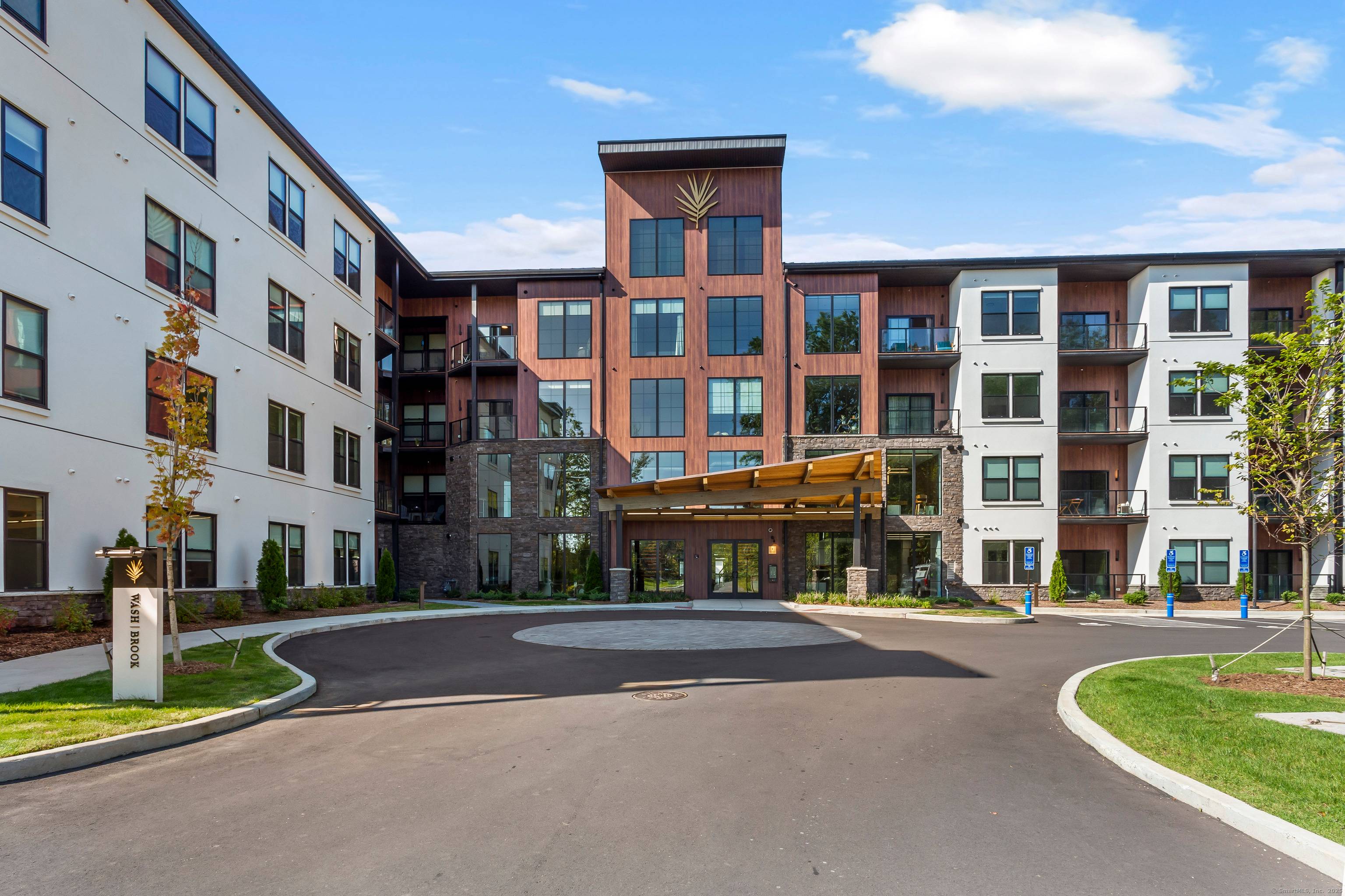 Experience Elevated Living at The Residences at Wash Brook Set beside 15 acres of protected woodland, this Aspen ski lodge inspired community blends nature with luxury.
