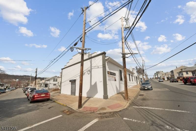 Freestanding Corner Warehouse with Drive In Dock, Office, Basement New Sprinkler System.