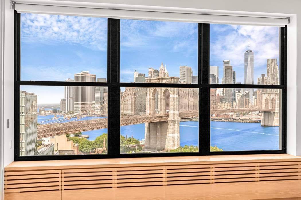 Enjoy breathtaking views of the Brooklyn Bridge, Brooklyn Bridge Park, East River, and the New York City Skyline, all perfectly framed by oversized windows in this truly iconic DUMBO loft.