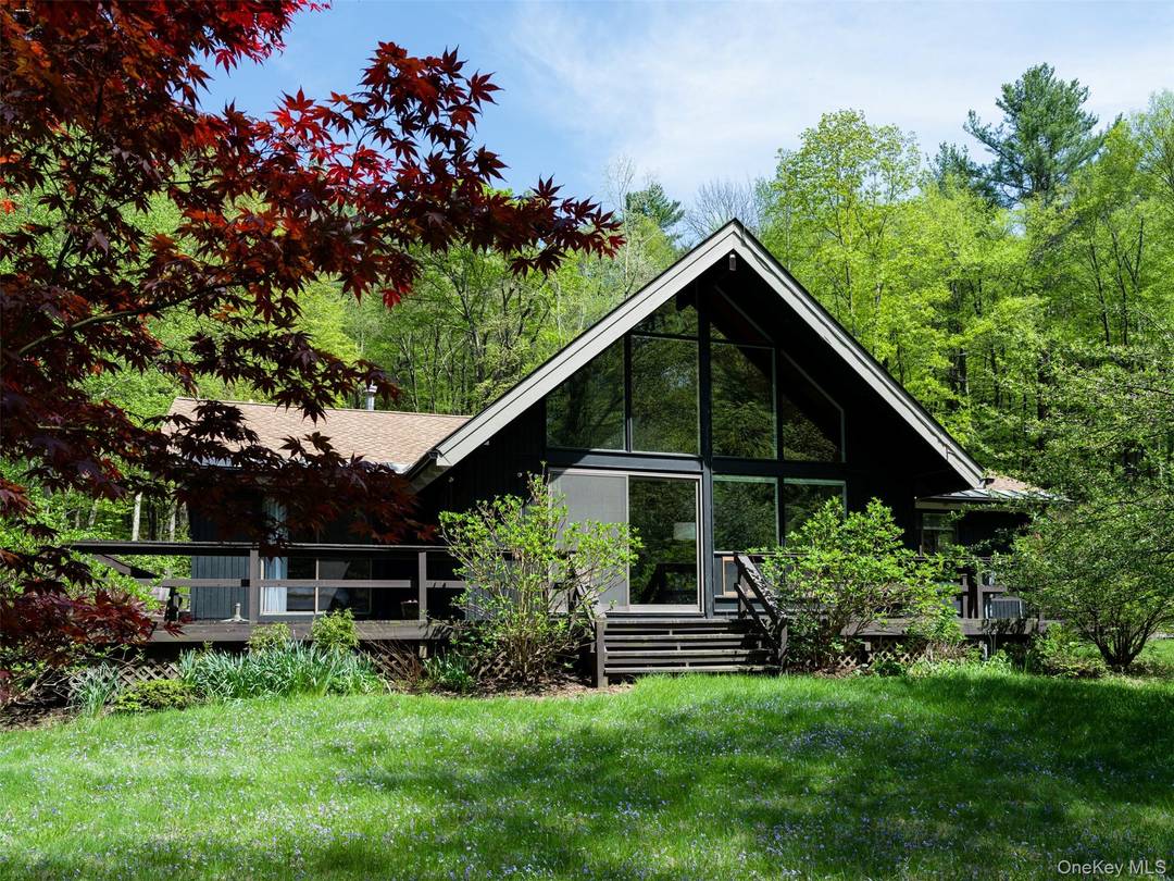 Discover a private Columbia County Berkshires retreat set on a secluded, wooded lot just minutes from skiing and top regional attractions.
