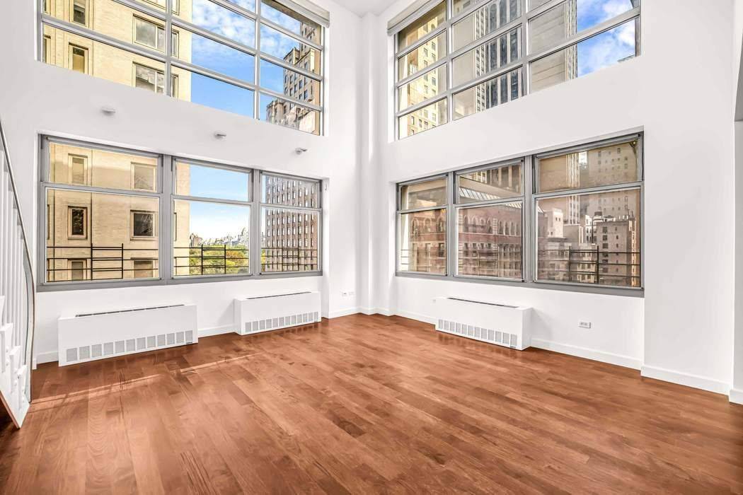 Dramatic Duplex with Central Park Views Just One Block from the Park This rarely available 3 bedroom, 3.