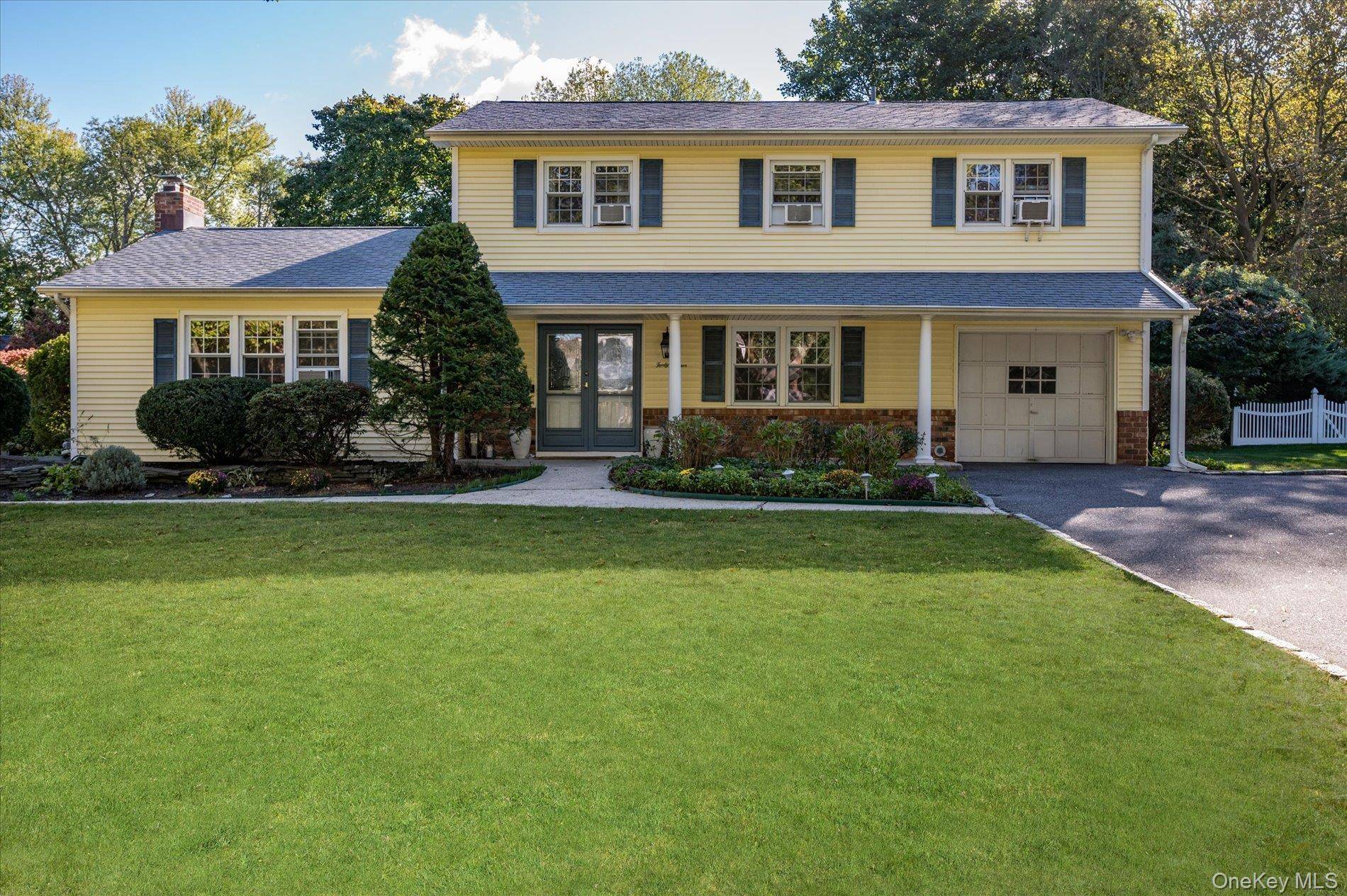 Well appointed, four bedroom, three bath Colonial home on an half an acre of property which backs to Greenlawn Park's beautiful, treed green space perfect for family gatherings.