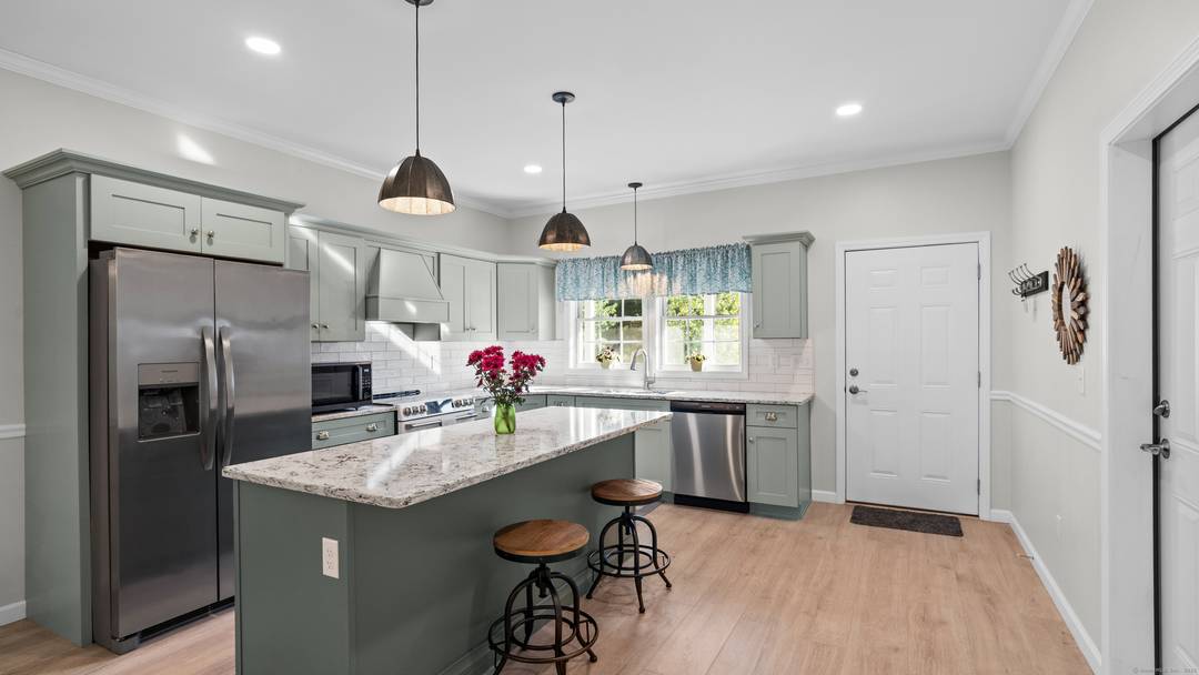 Welcome to 10 Grace Lane in Moosup River Estates, a desirable 55 community offering low maintenance living in a peaceful riverside setting.