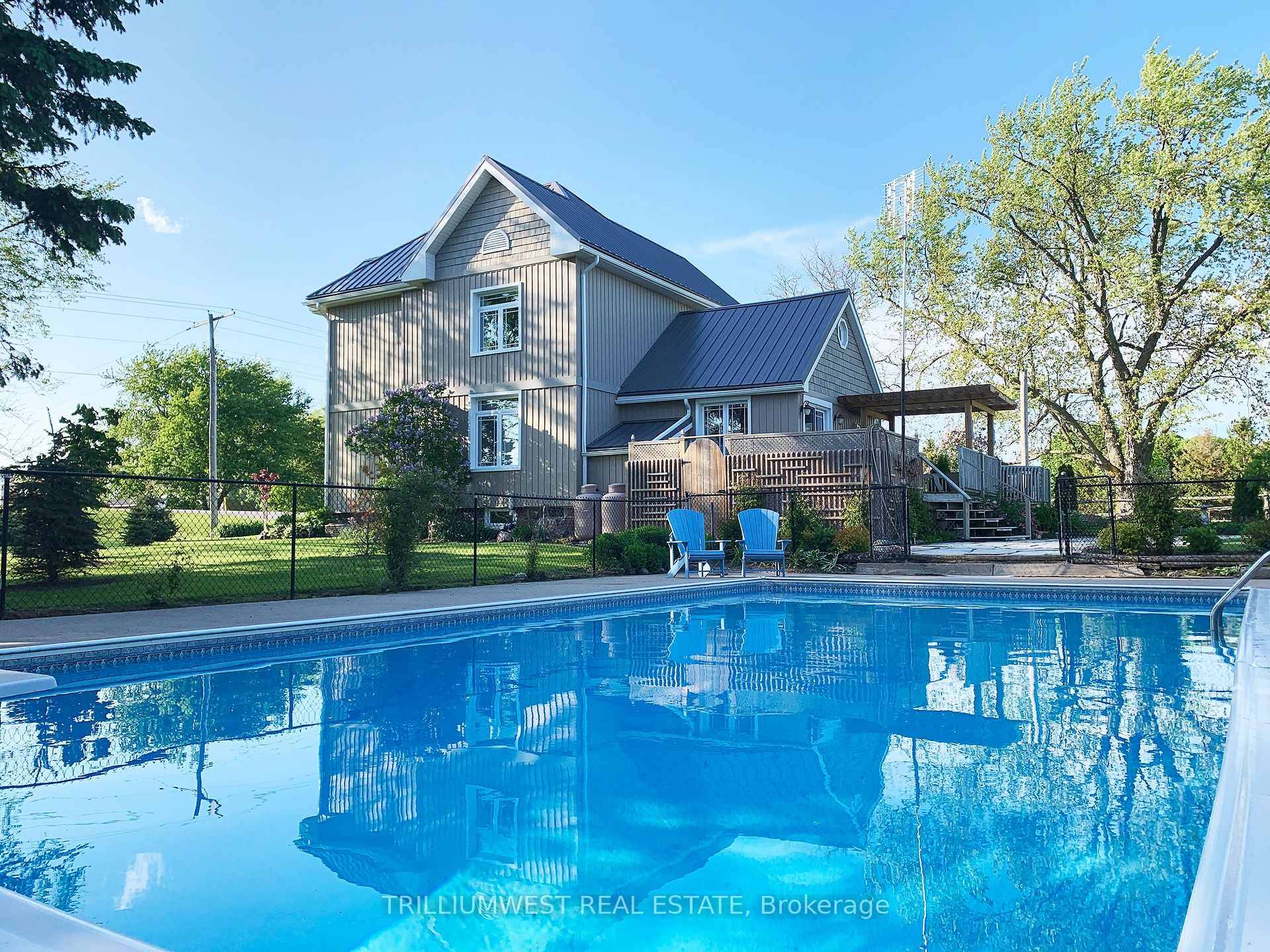 Welcome to 2999 Road 119 where country serenity meets modern living on nearly 5 acres just outside St.