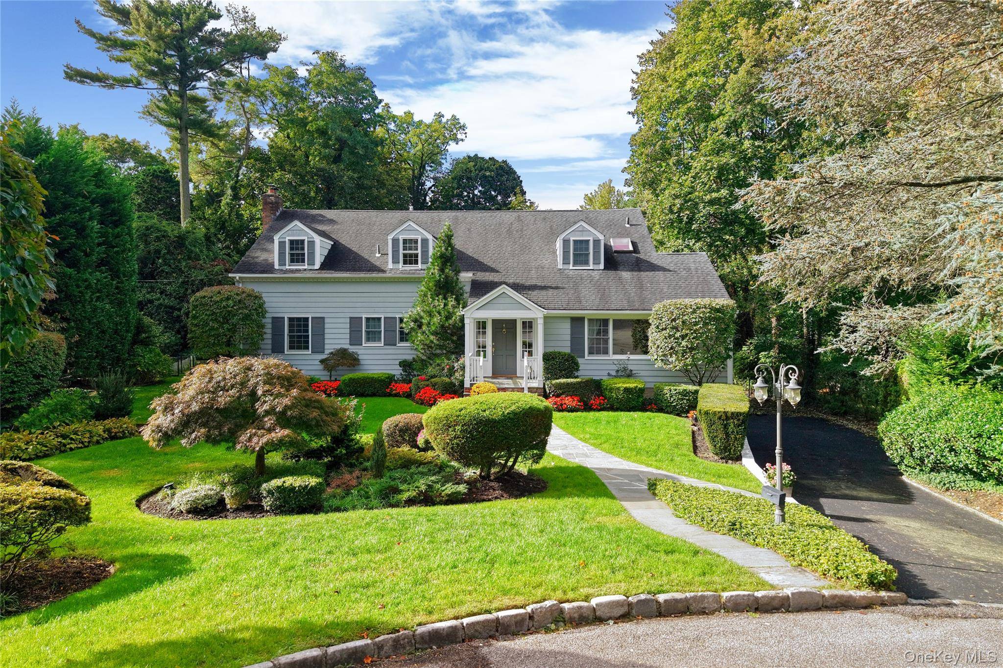 Perfectly situated on a beautiful cul de sac, this elegant traditional home offers space, timeless appeal and privacy on a picturesque half acre.