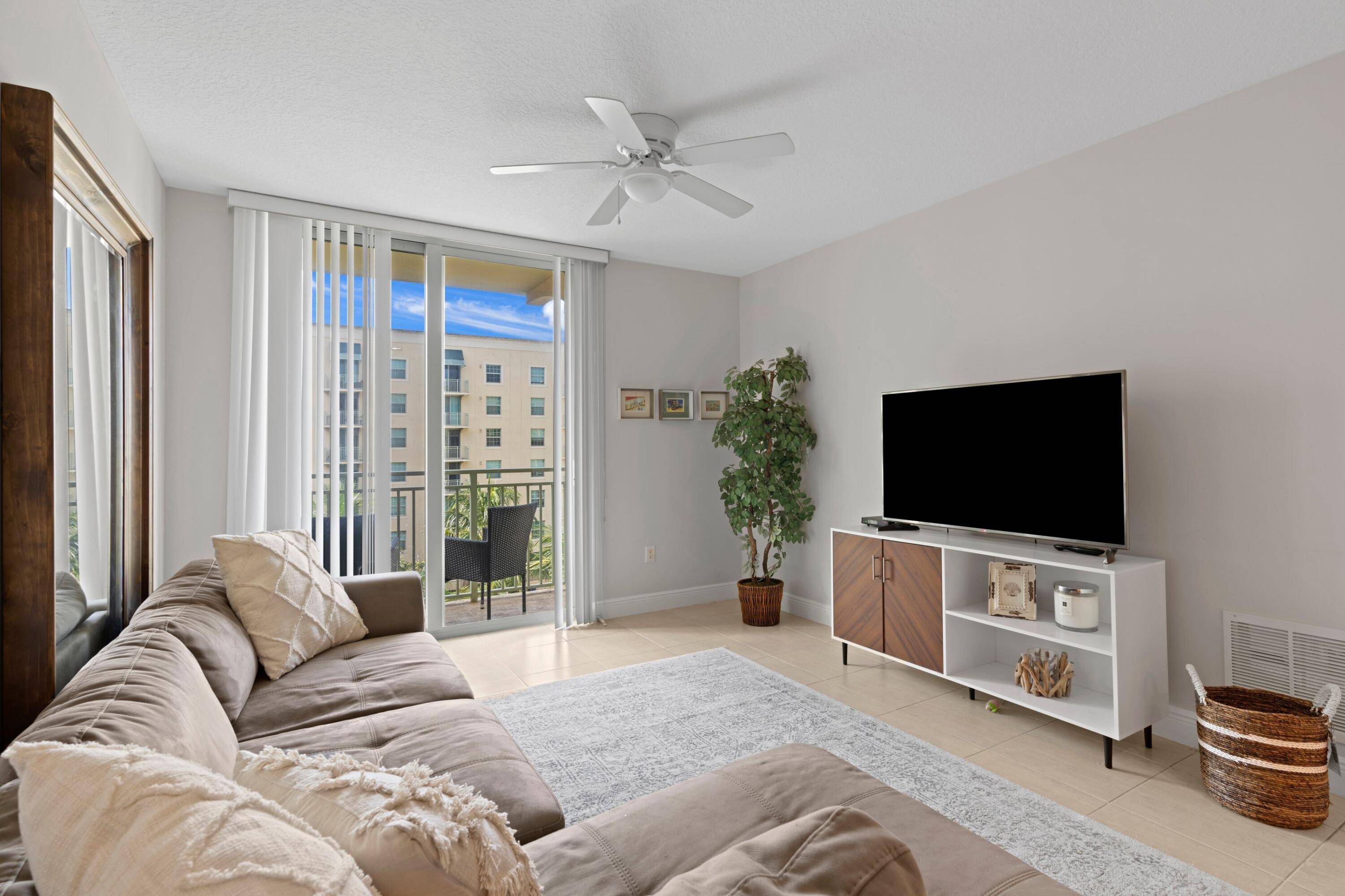 Spacious 2 2 condo in 610 Clematis with a relaxing view of the interior resort style pool lush garden.