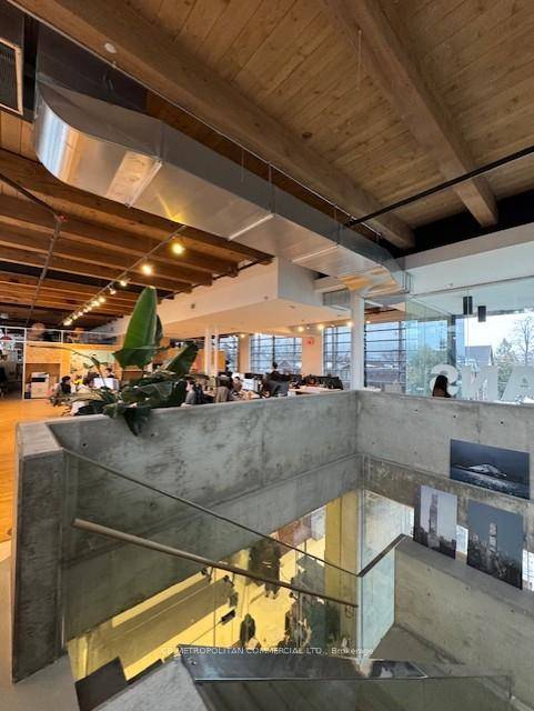 2nd floor creative brick and beam space with 14 ft ceiling.